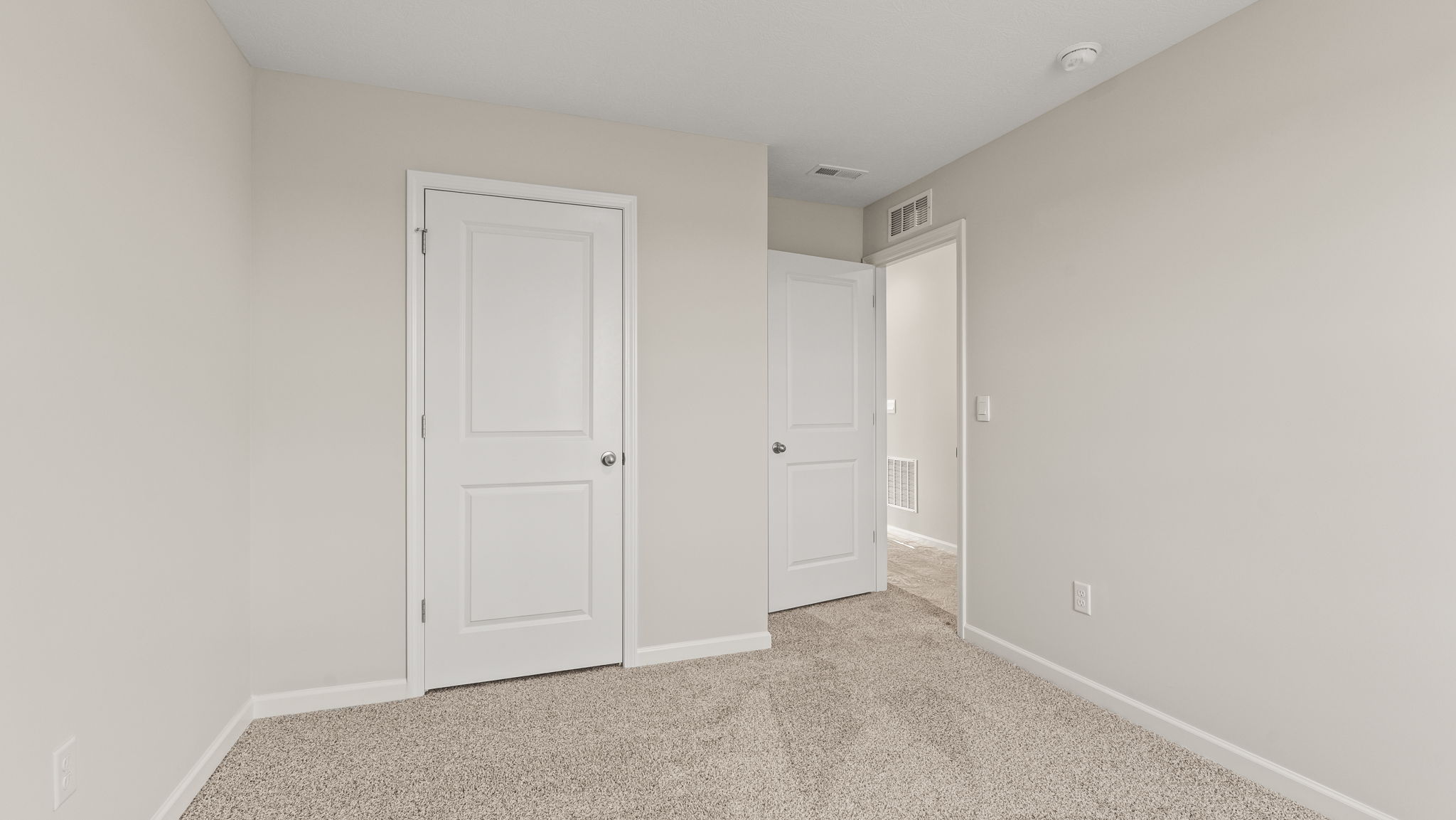 Carpeted bedroom with window