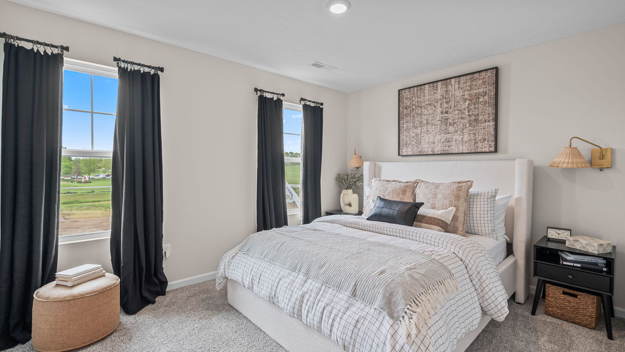 Bedroom with carpeted floors.