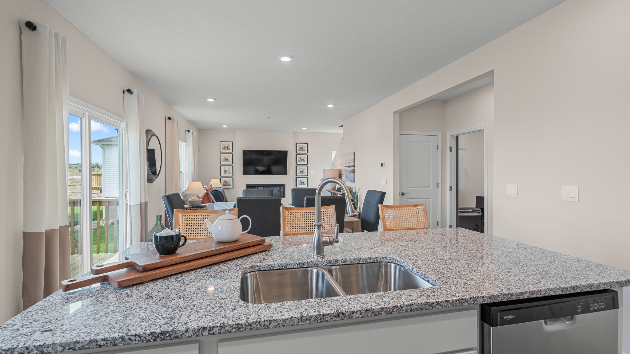 Large kitchen island with Whirlpool dishwasher.