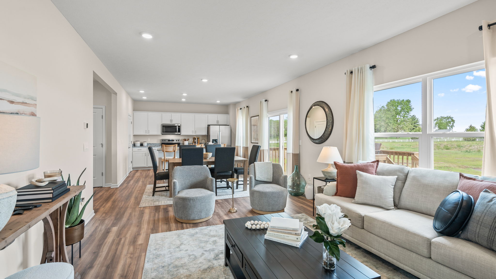 Living room with large window for natural lighting.