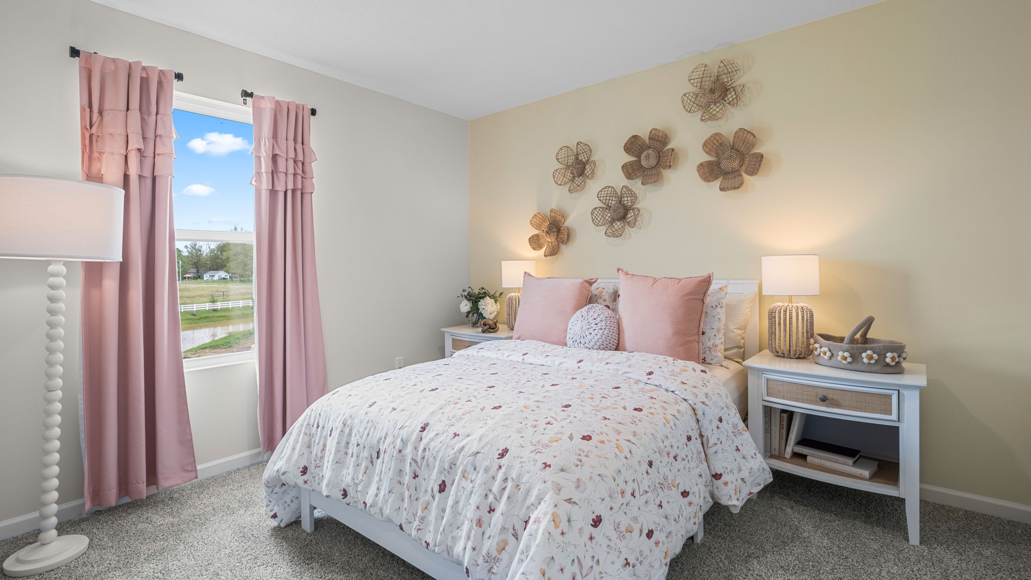 Bedroom with large window for natural lighting.