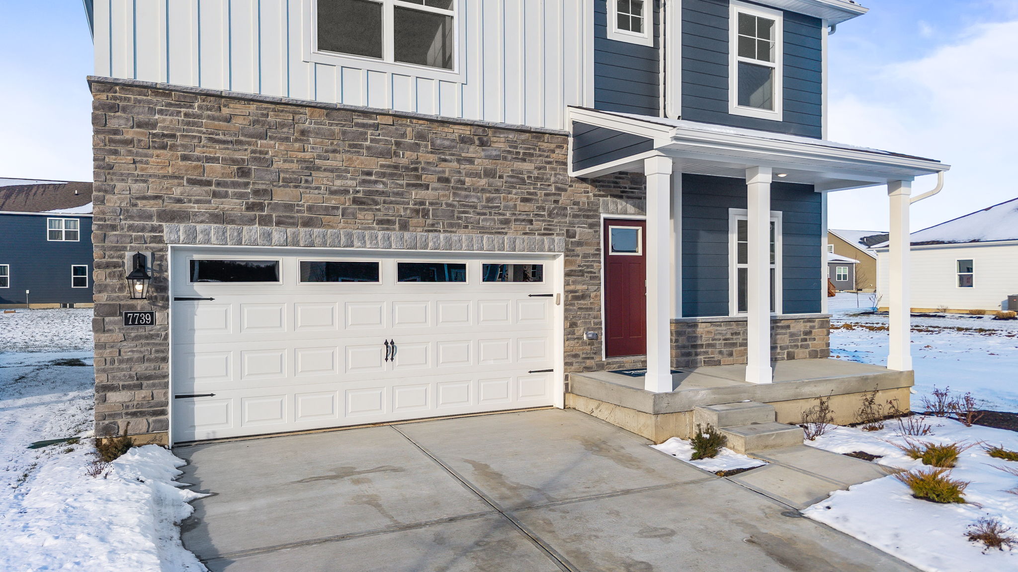 Closeup of 7739 cilantro way garage and porch