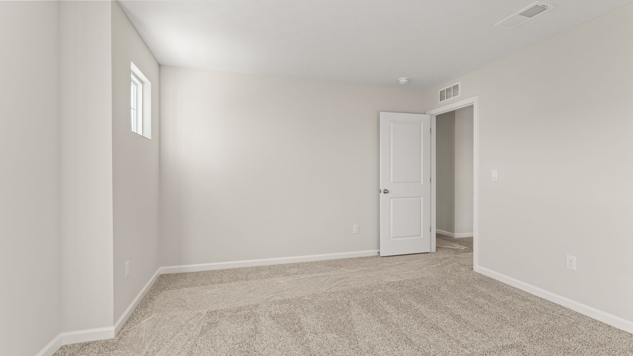 Bedroom with view of hallway door
