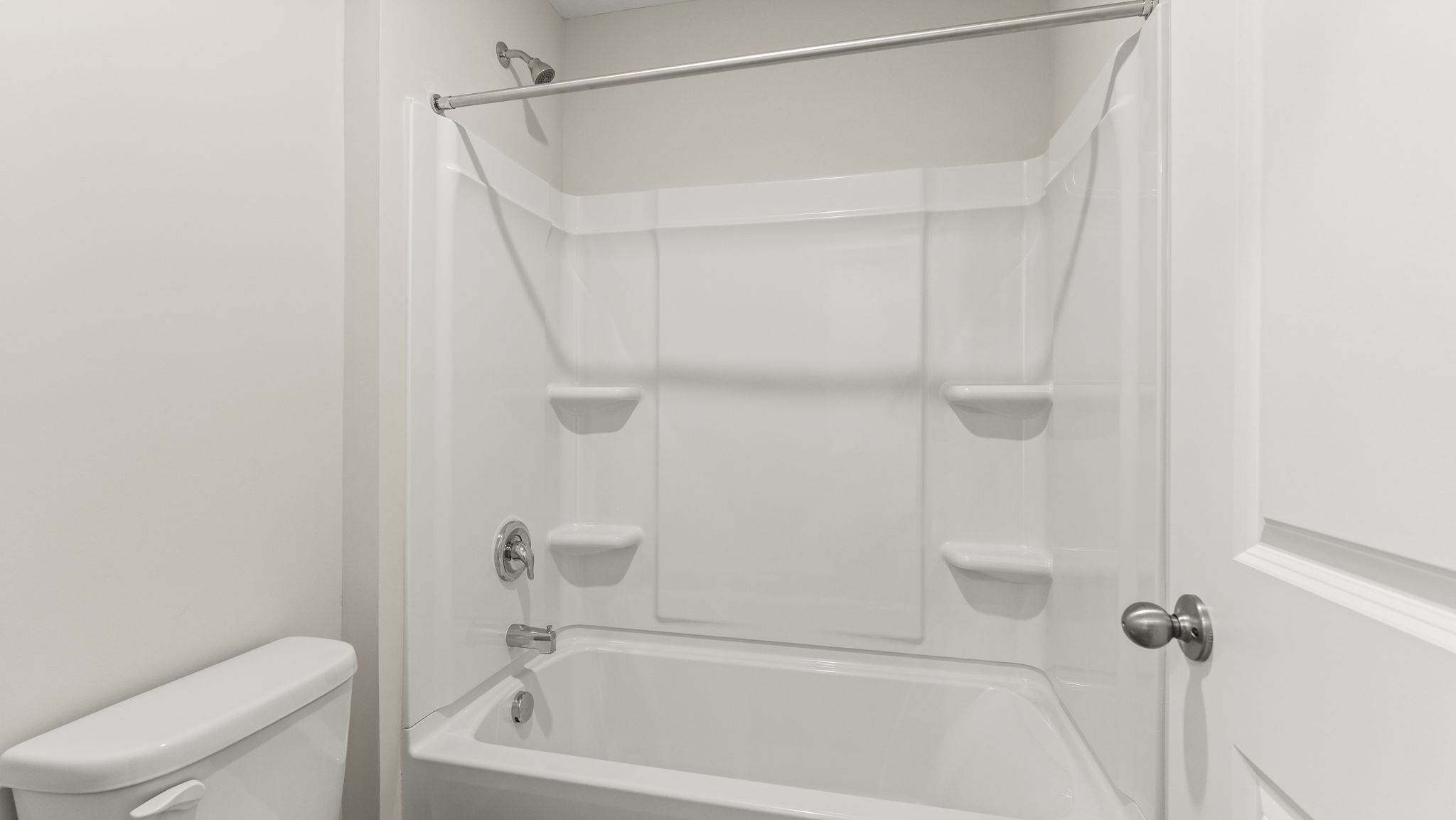 Closeup of tub with tiered shelving