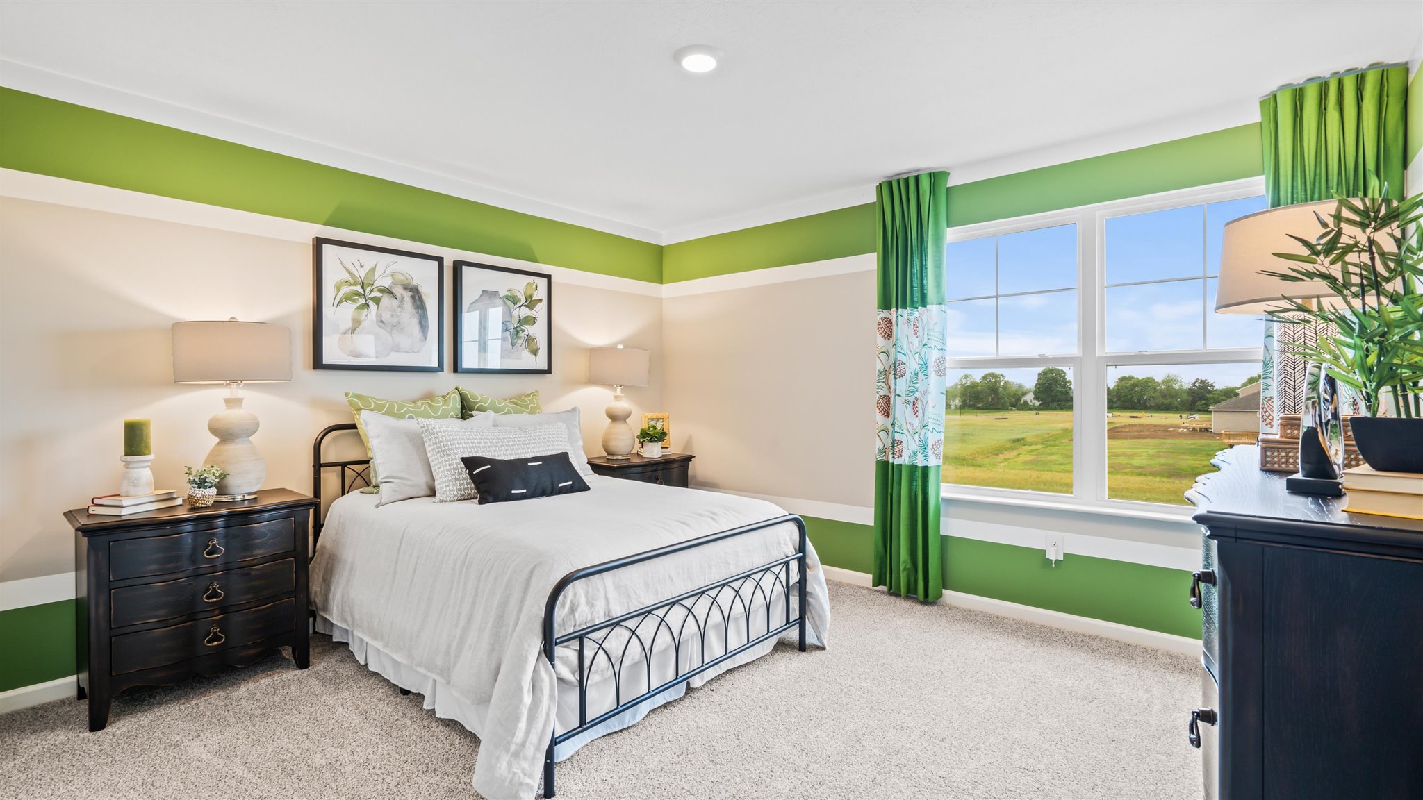 Bedroom 3 with earthy accents and large windows.