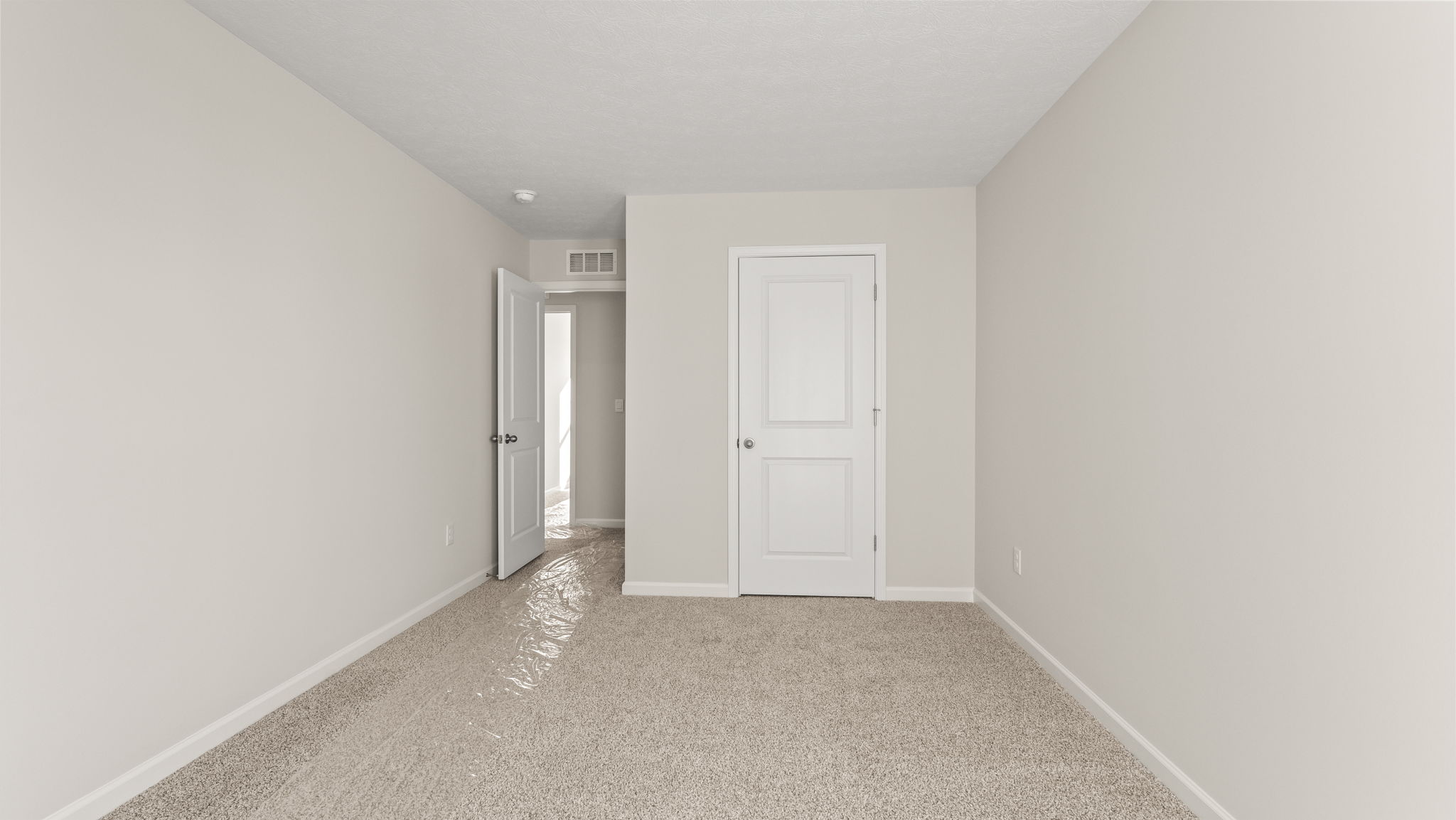 Bedroom looking into hallway