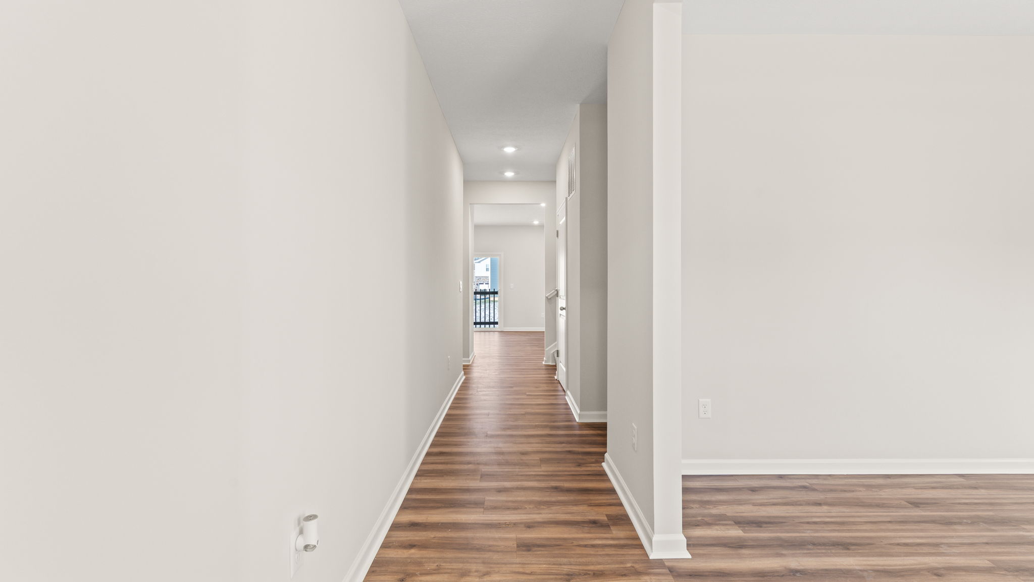 Entry way with hall into great room and dining room