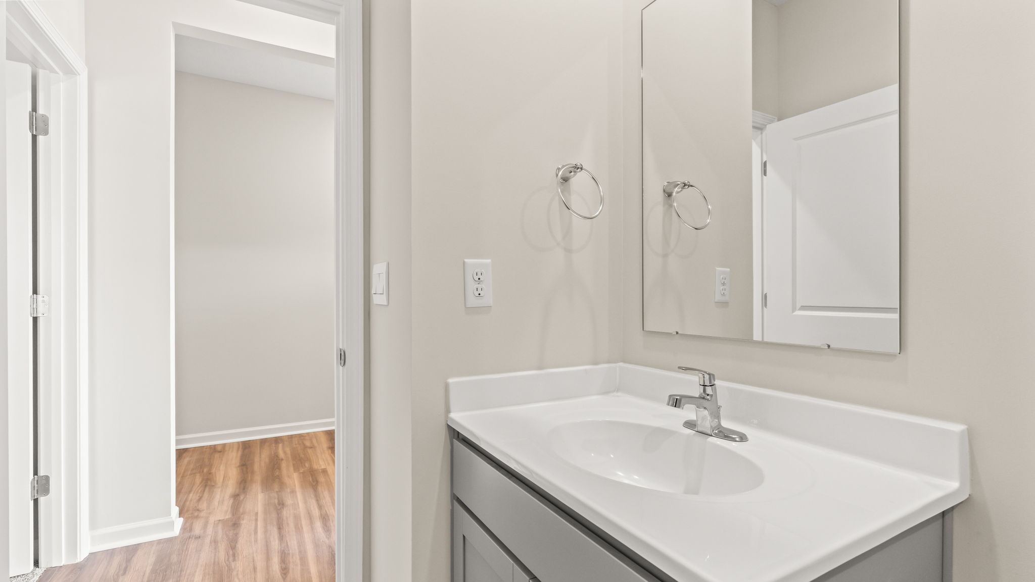 Closeup of bathroom sink and mirror