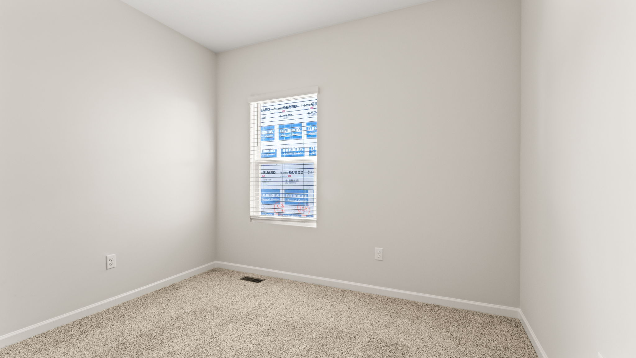 Carpeted bedroom with window