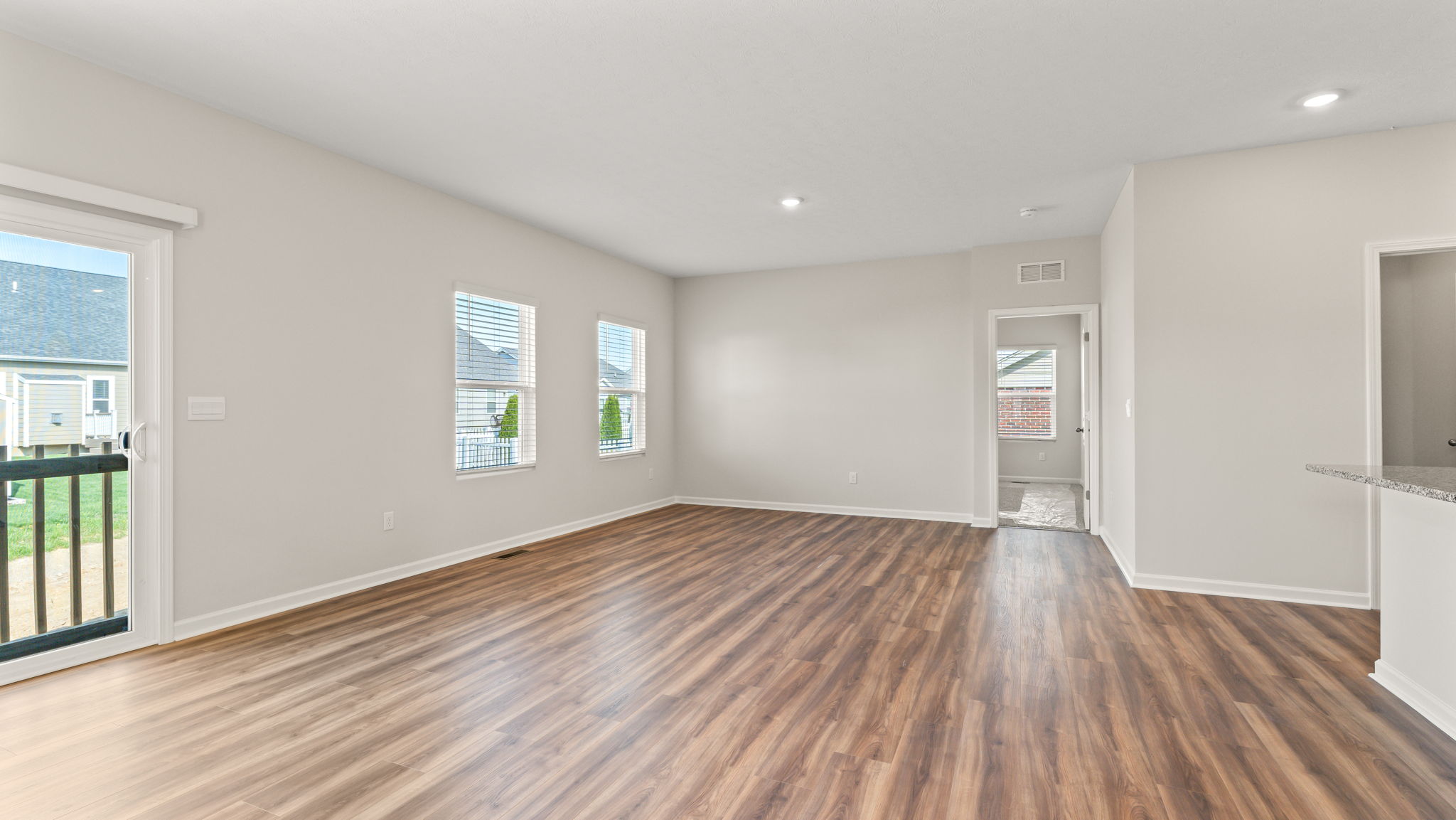 Great room leading into primary bedroom