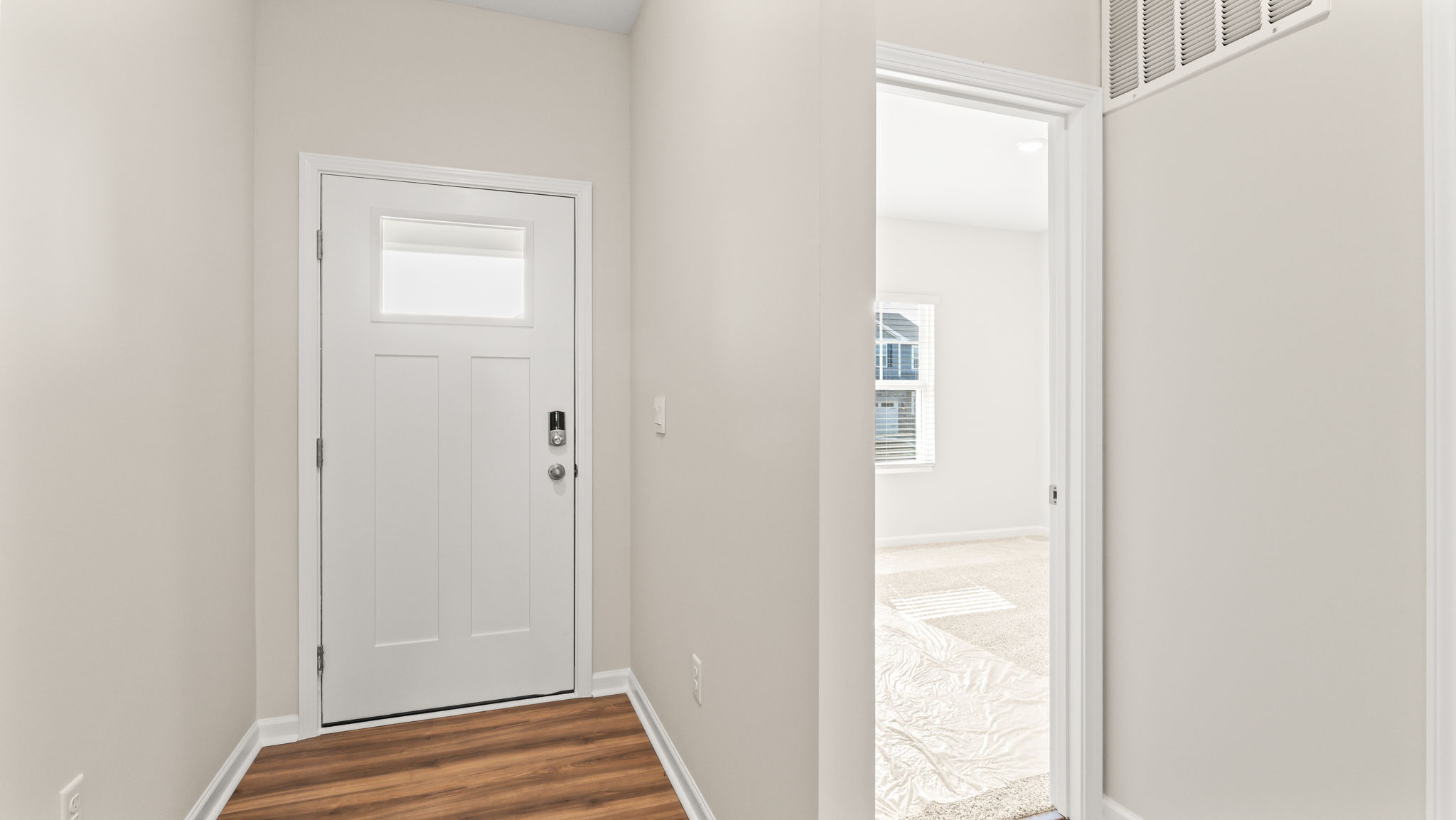 Front of the home with front door and next to the bedroom