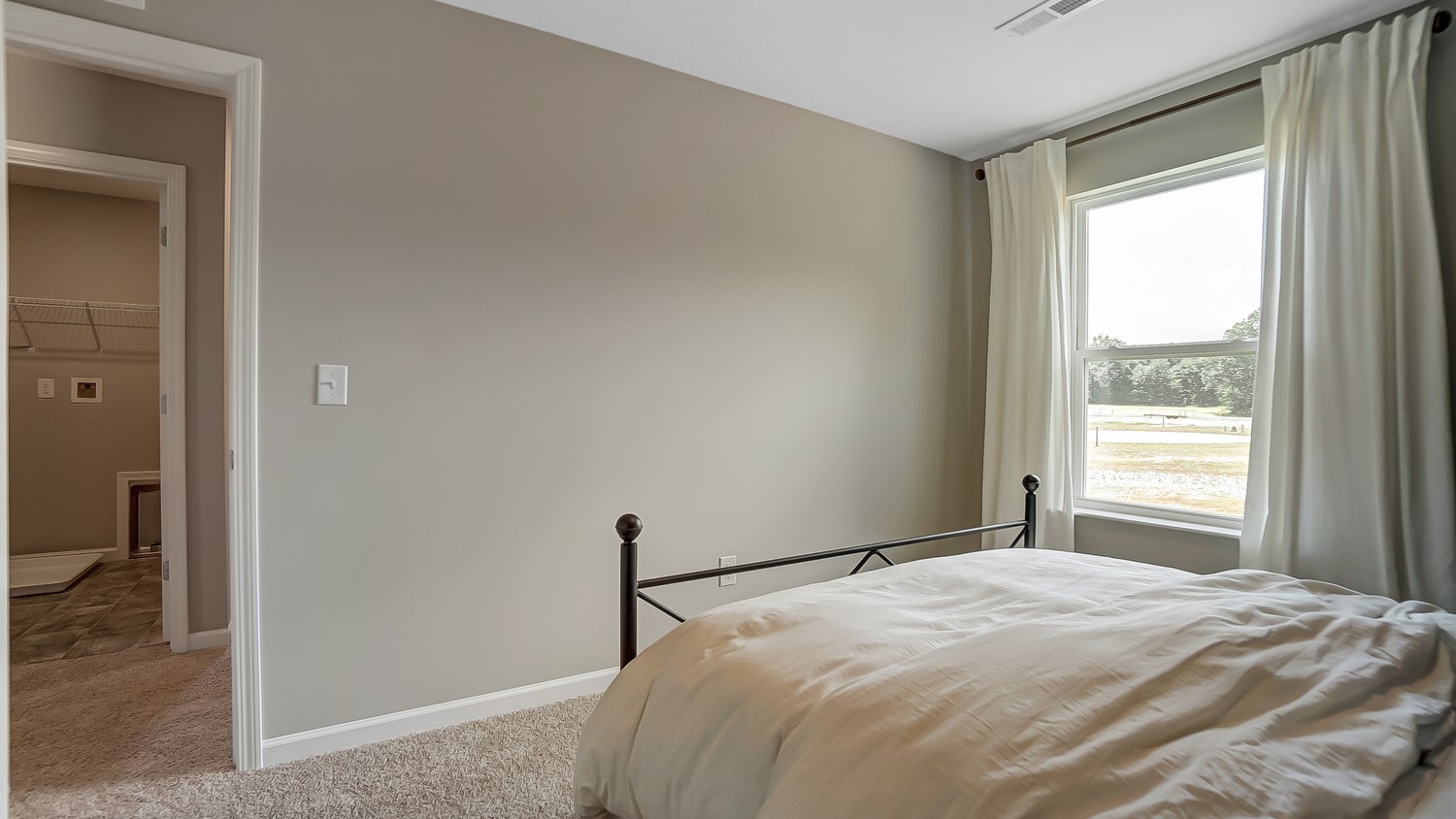 Bedroom 2 with view of hallway.
