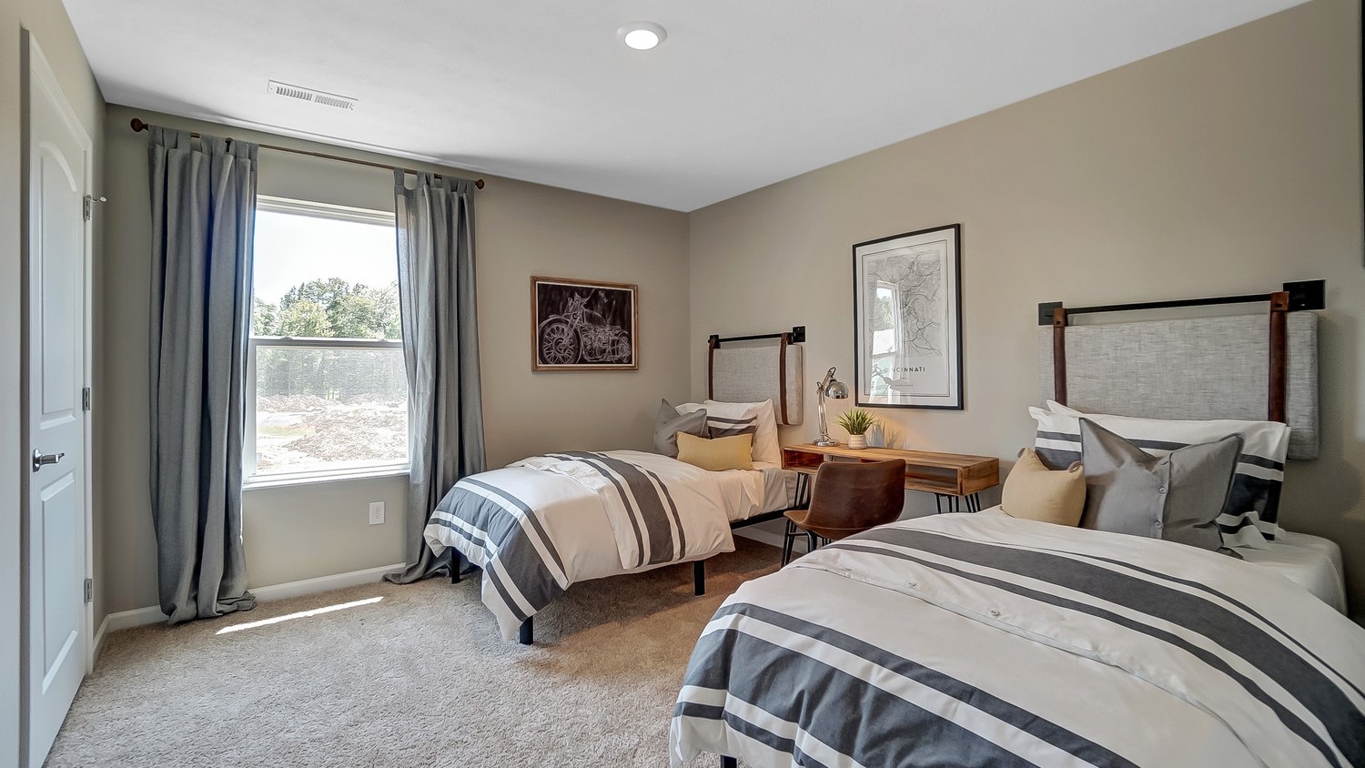 Bedroom 3 with dual twin beds and modern art.
