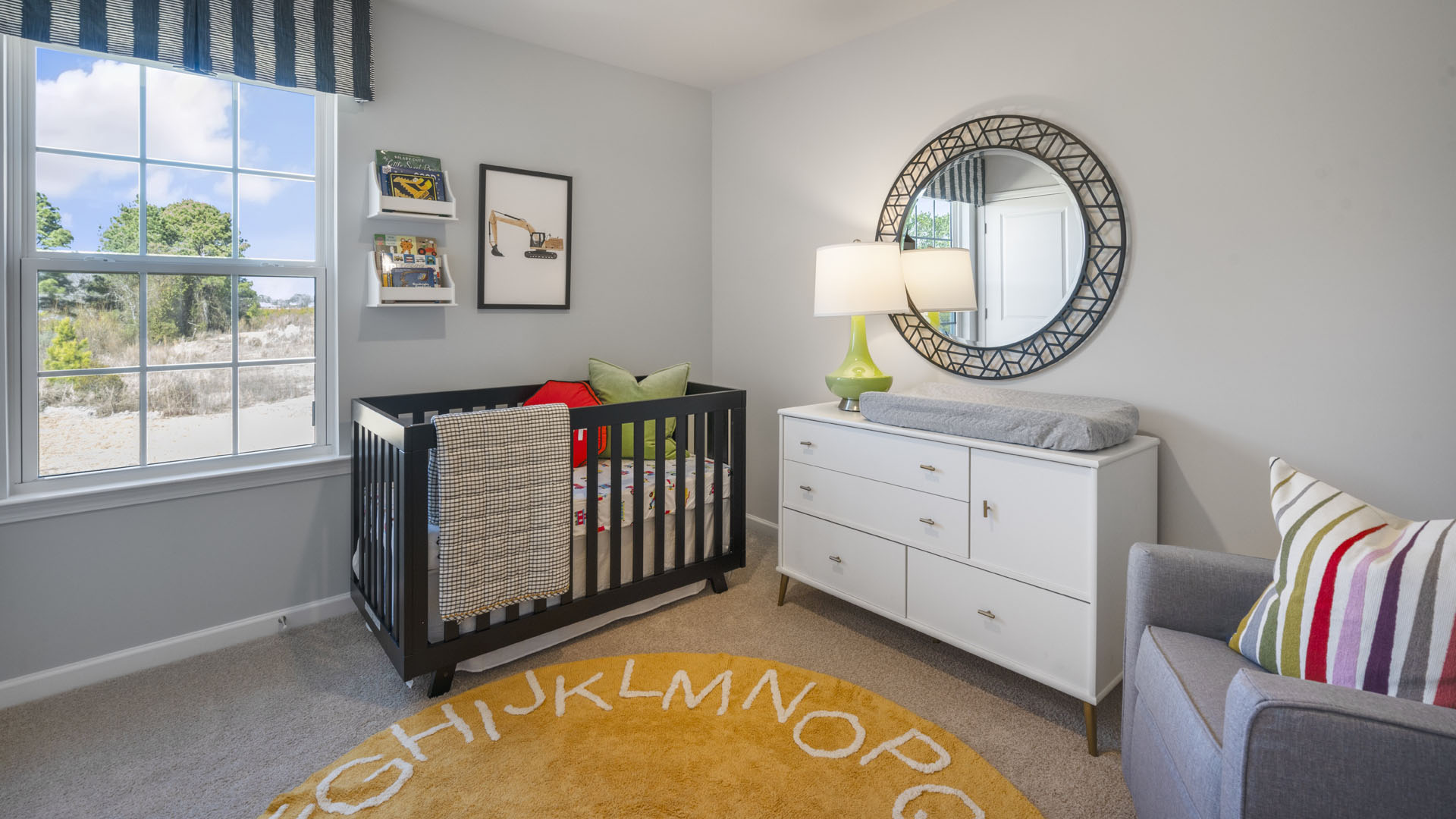 Bedroom that is a nursery with crib and large window.