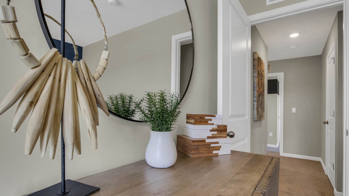 Hallway with dresser and modern decorations