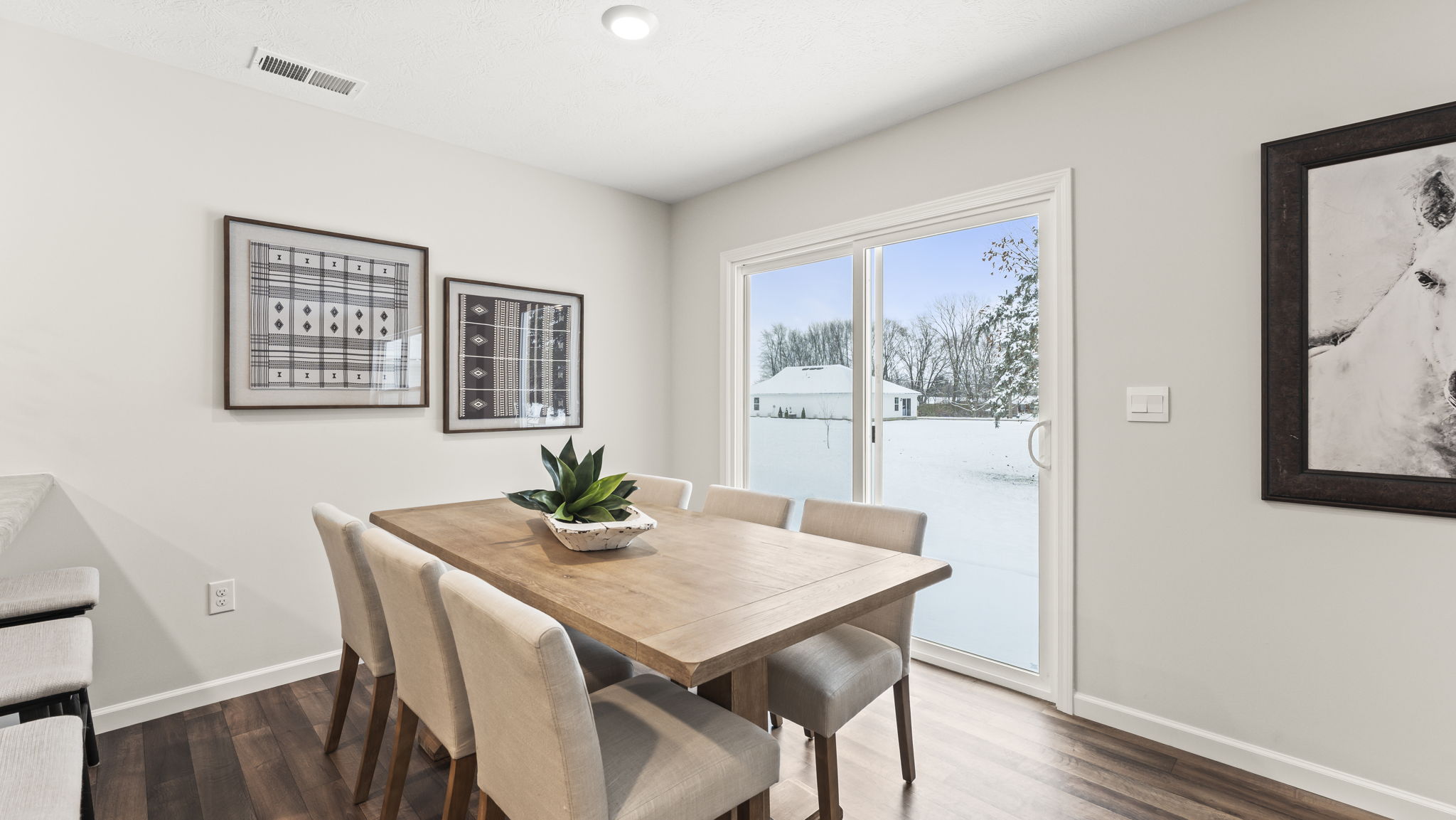 Dining room with natural light, open access and seamless flow continuing to front foyer access
