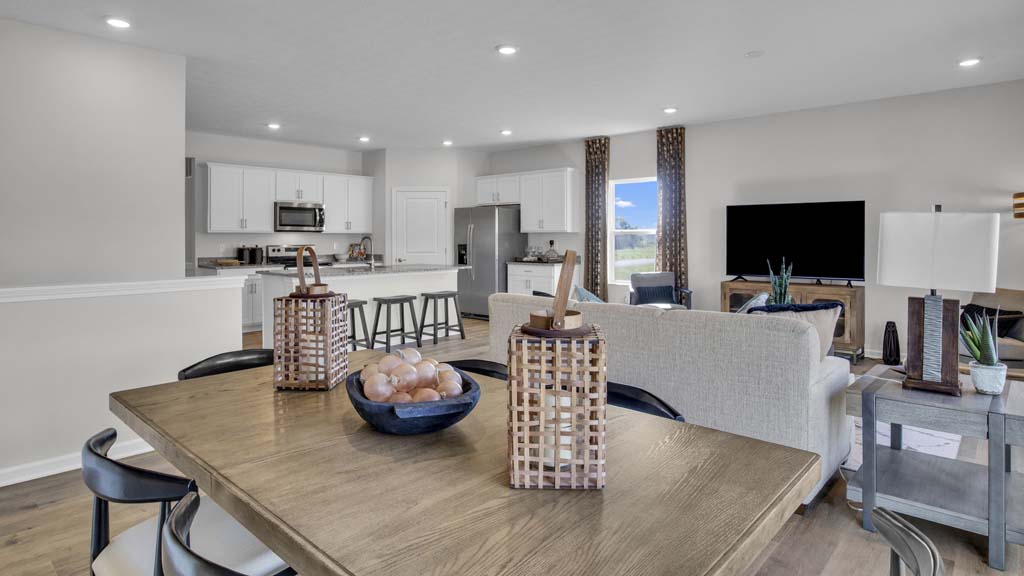 Full Great room featuring dining room, living room, and kitchen, all beautifuly decorated.