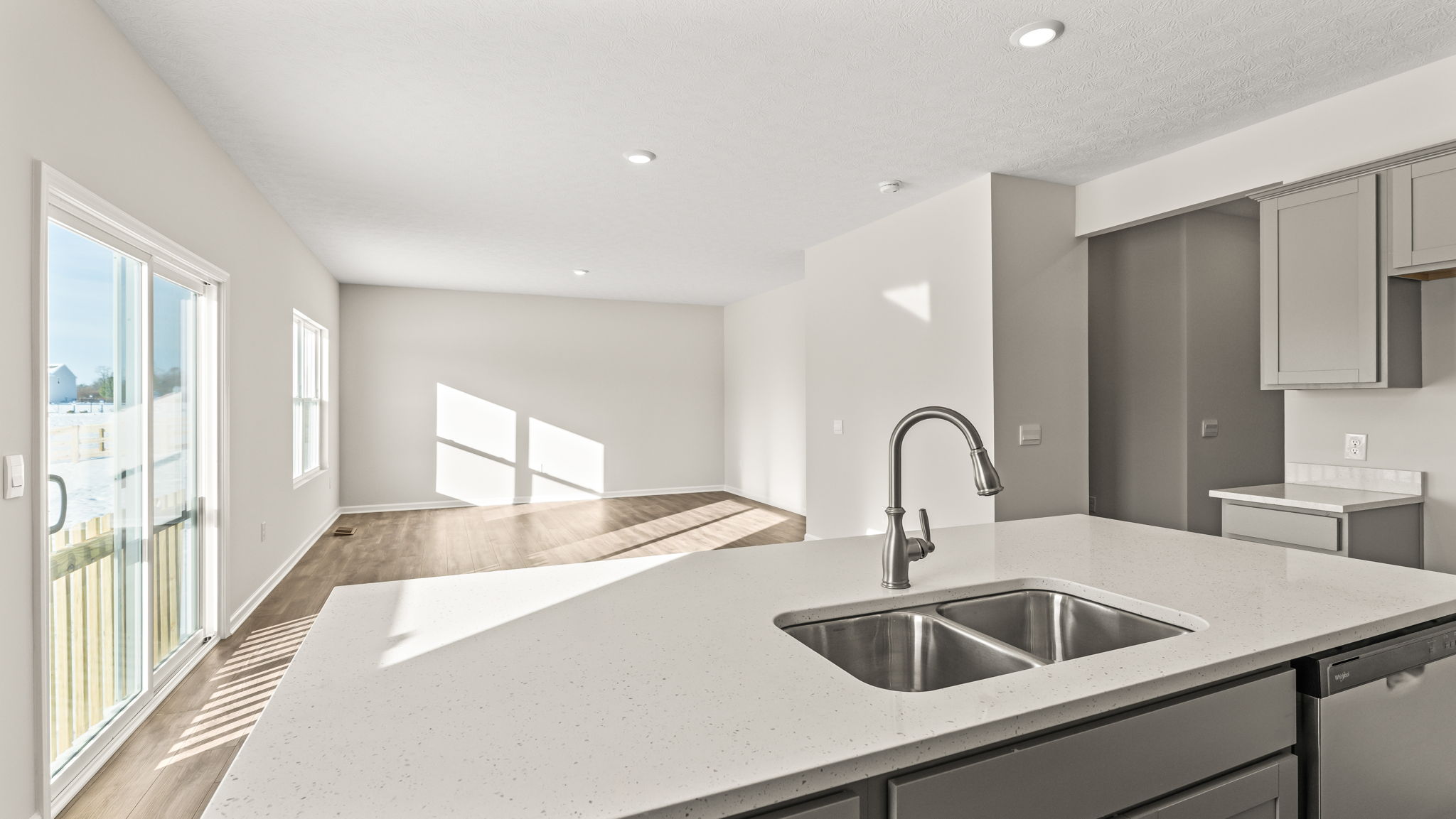 PErspective of the living area from the kitchen island.