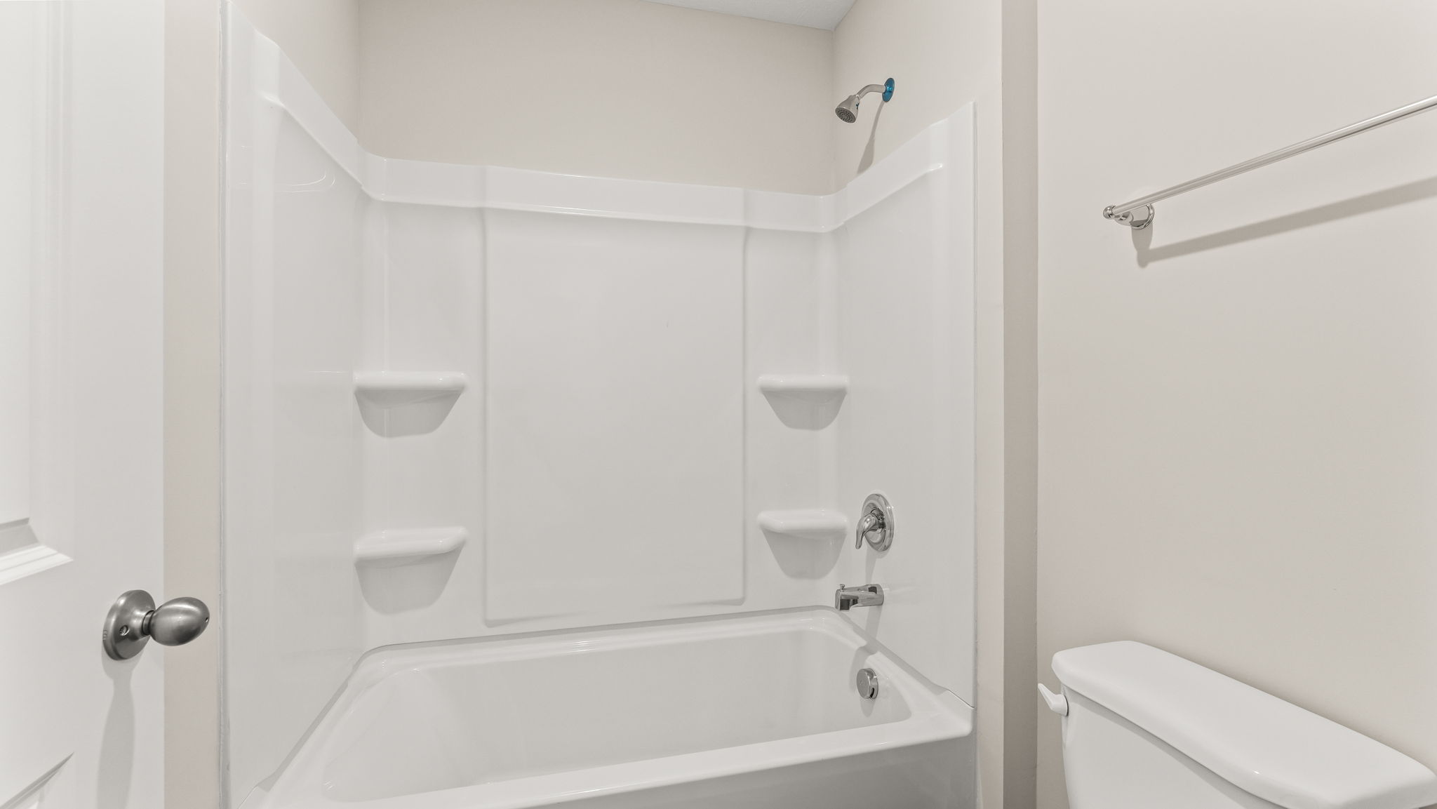 Closeup of tub with tiered shelving.