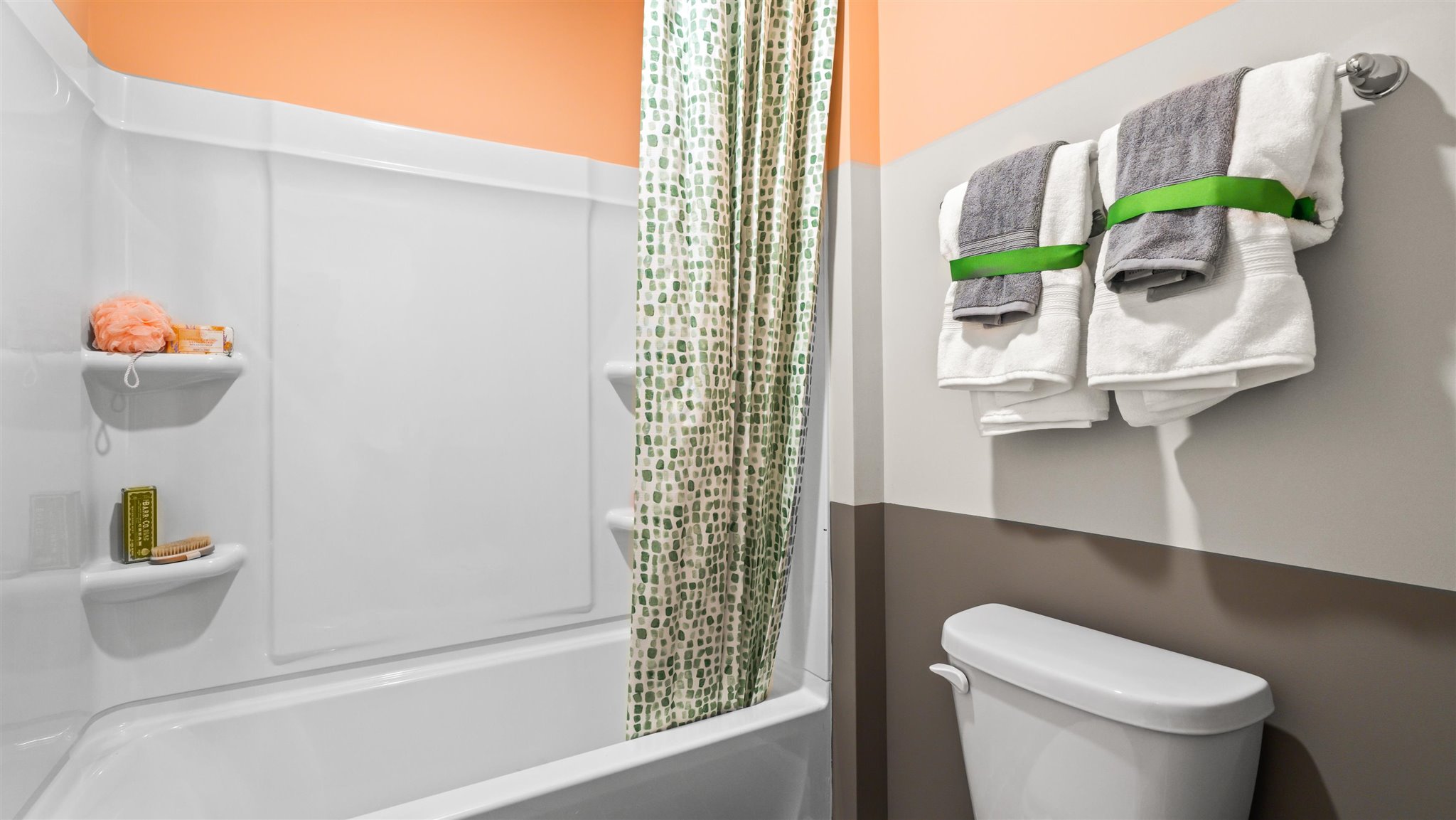 Separate toilet and shower and tub combo room.