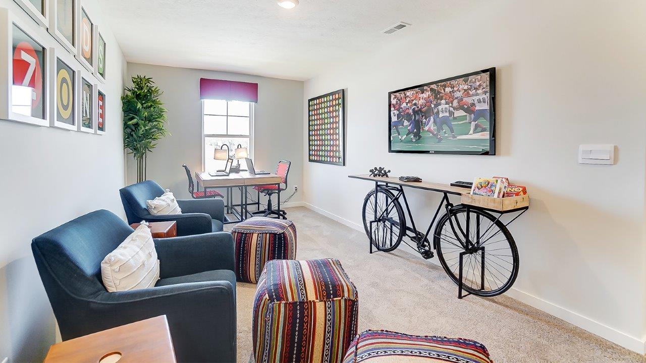 loft with window lighting and amble seating