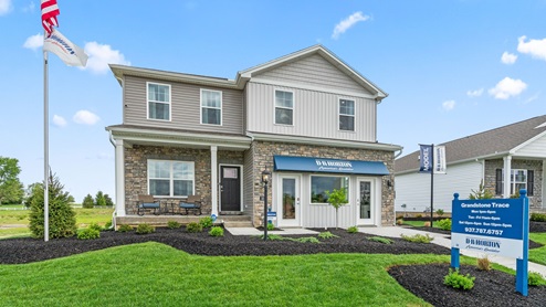 Front exterior of model home at Grandstone Trace community.