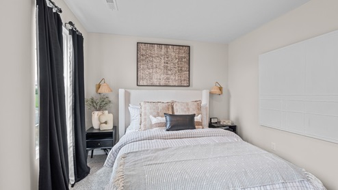 Bedroom with carpeted floors.