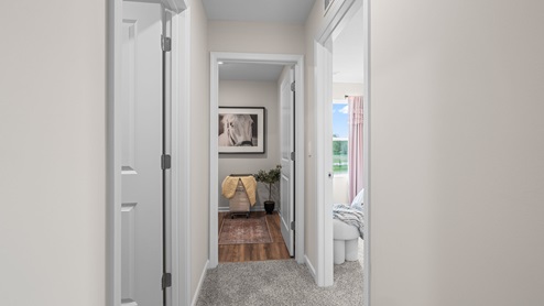 Hallway between bedrooms and laundry space.
