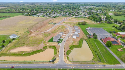 Aerial view of neighborhood with ponds nearby.