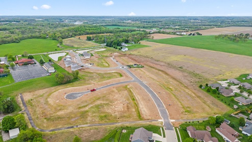 Aerial view of neighborhood with space for more lots.