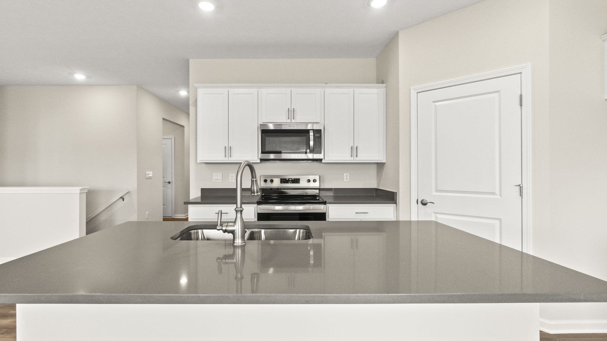 Direct image of oven range and kitchen island.