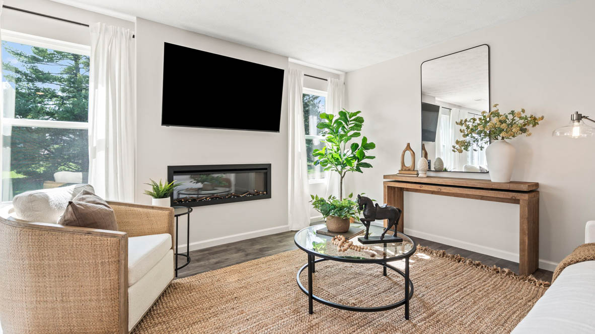 close up of living room with glass coffee table and modern decorations with tv.