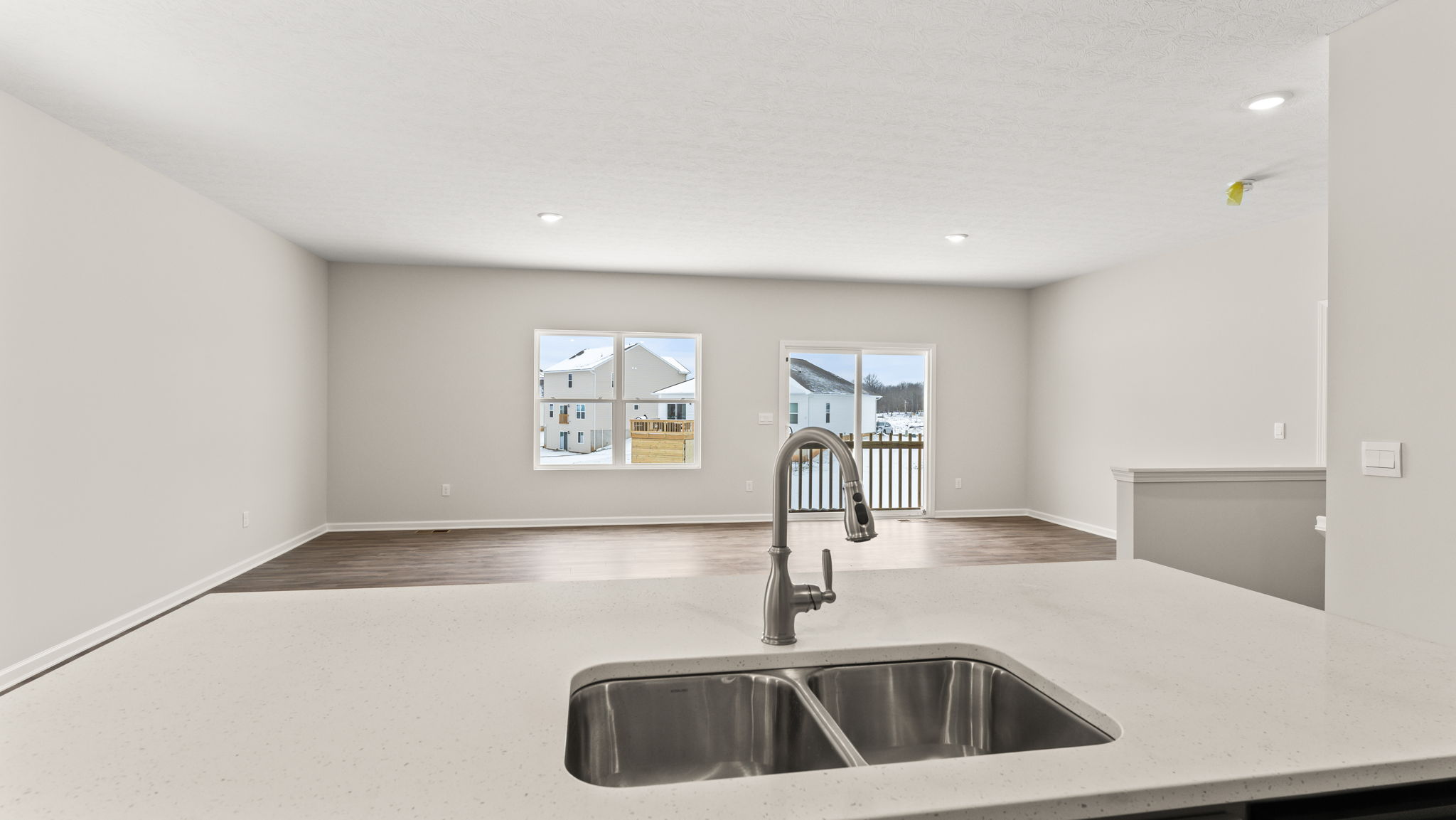 Perspective of the living and dining room from the kitchen island
