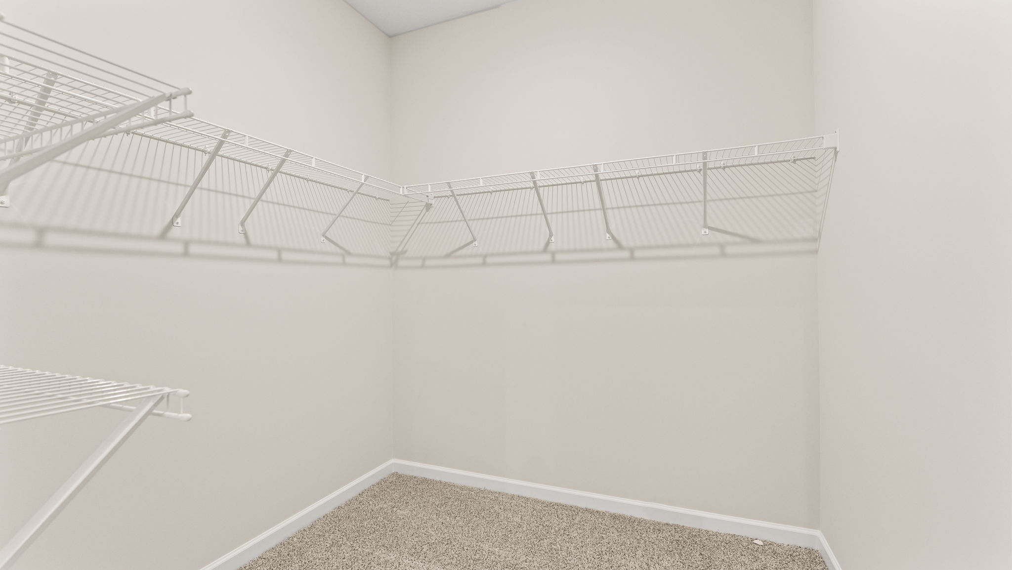 Walk-in Closet with wire rack shelving.