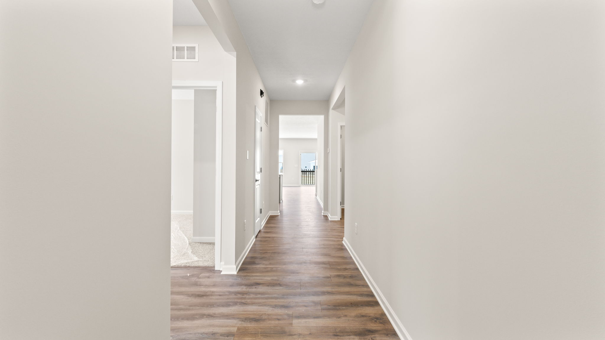Entranceway with bedroom on the left and great room in the center.