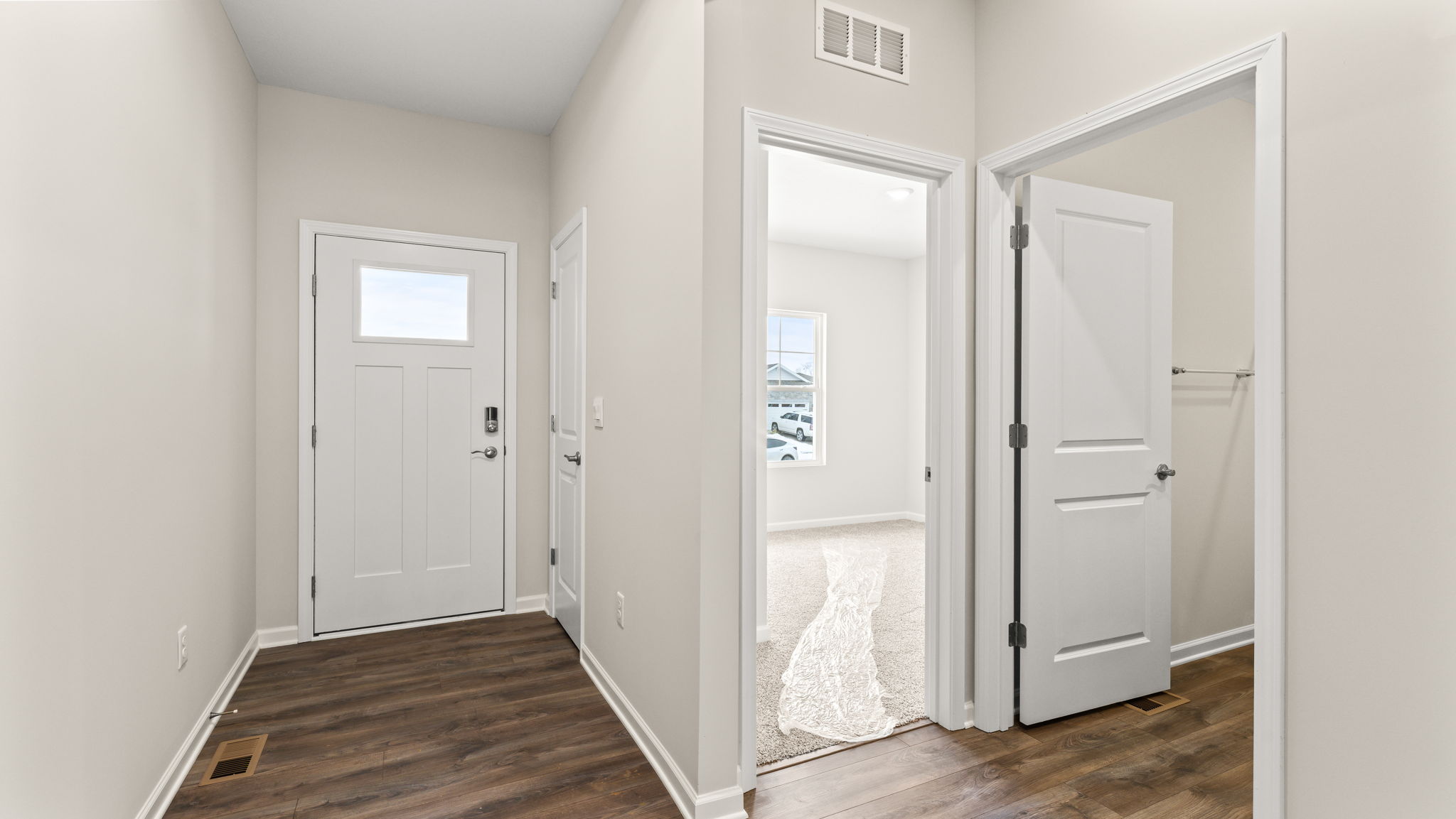 Front door next to bedroom.