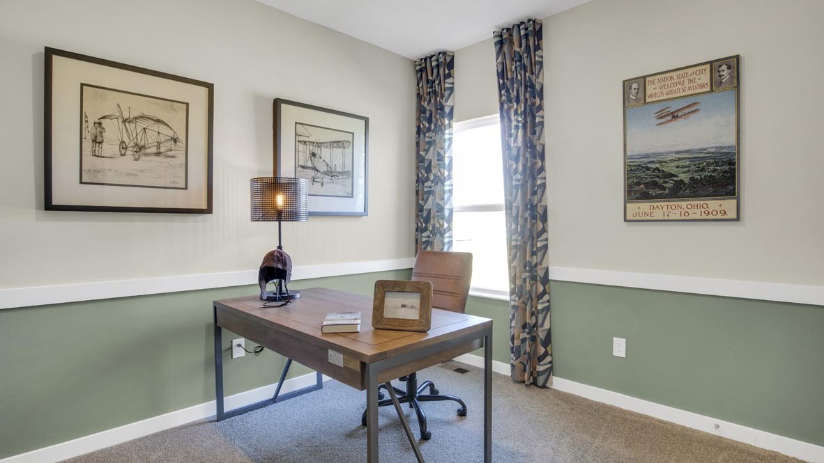 Bedroom shown as dayton air themed office.