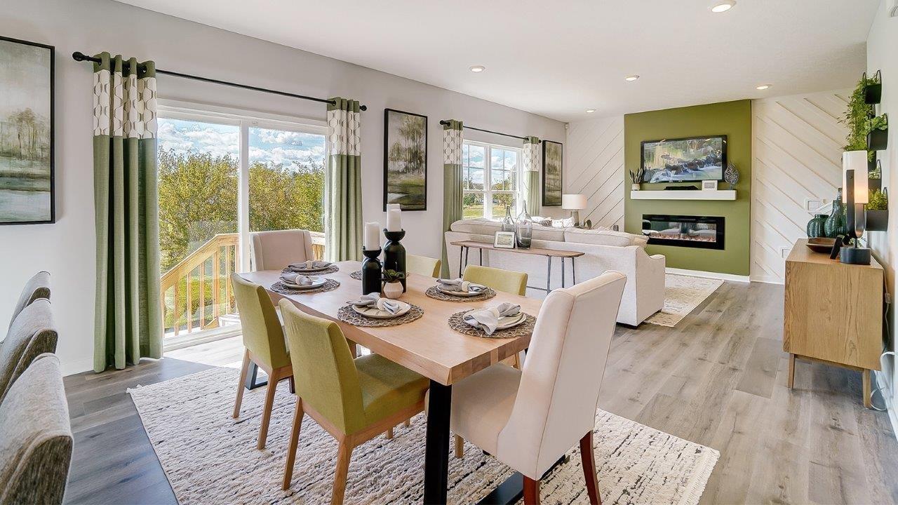 dining room and kitchen with back sliding door and modern art.