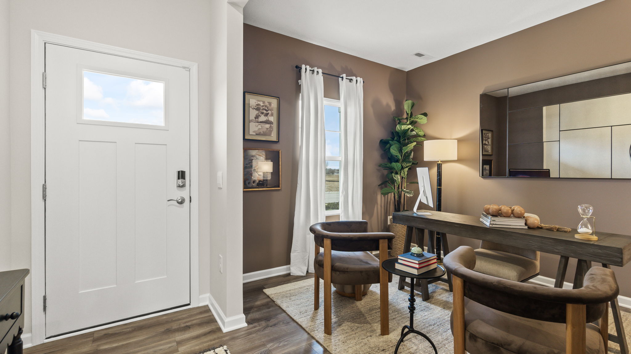 Front of home with front door on the left and office on the right.