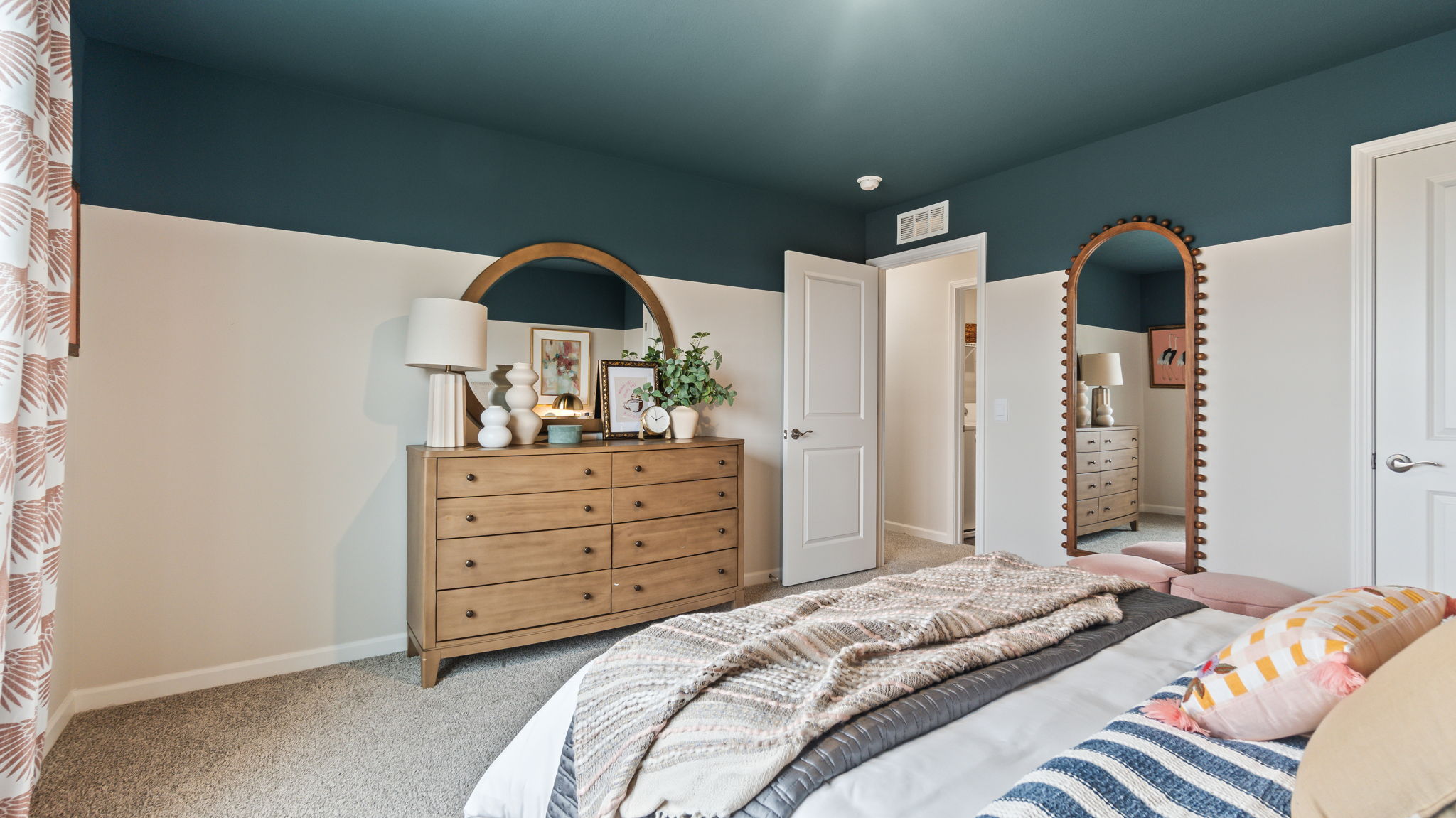 Bedroom 3 with dresser/mirror combo, mirror, and door to hallway.