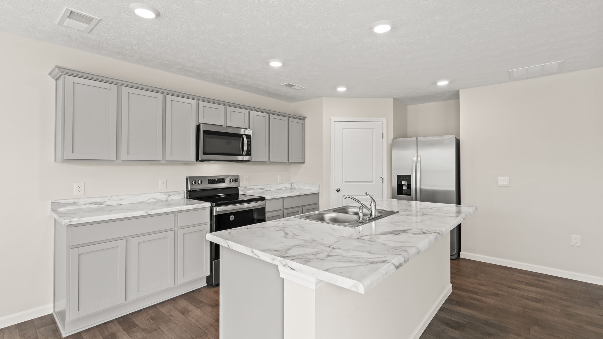 Three-quarter view of kitchen with island