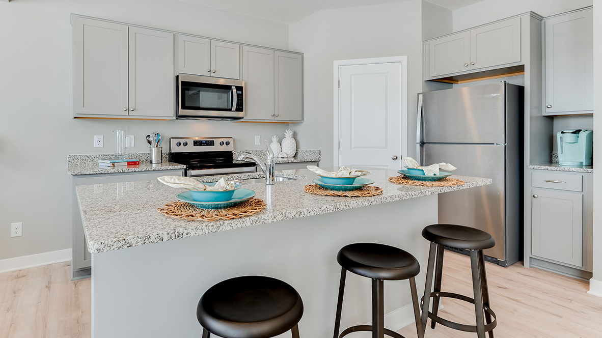 closeup of the kitchen island with turquoise bowls.