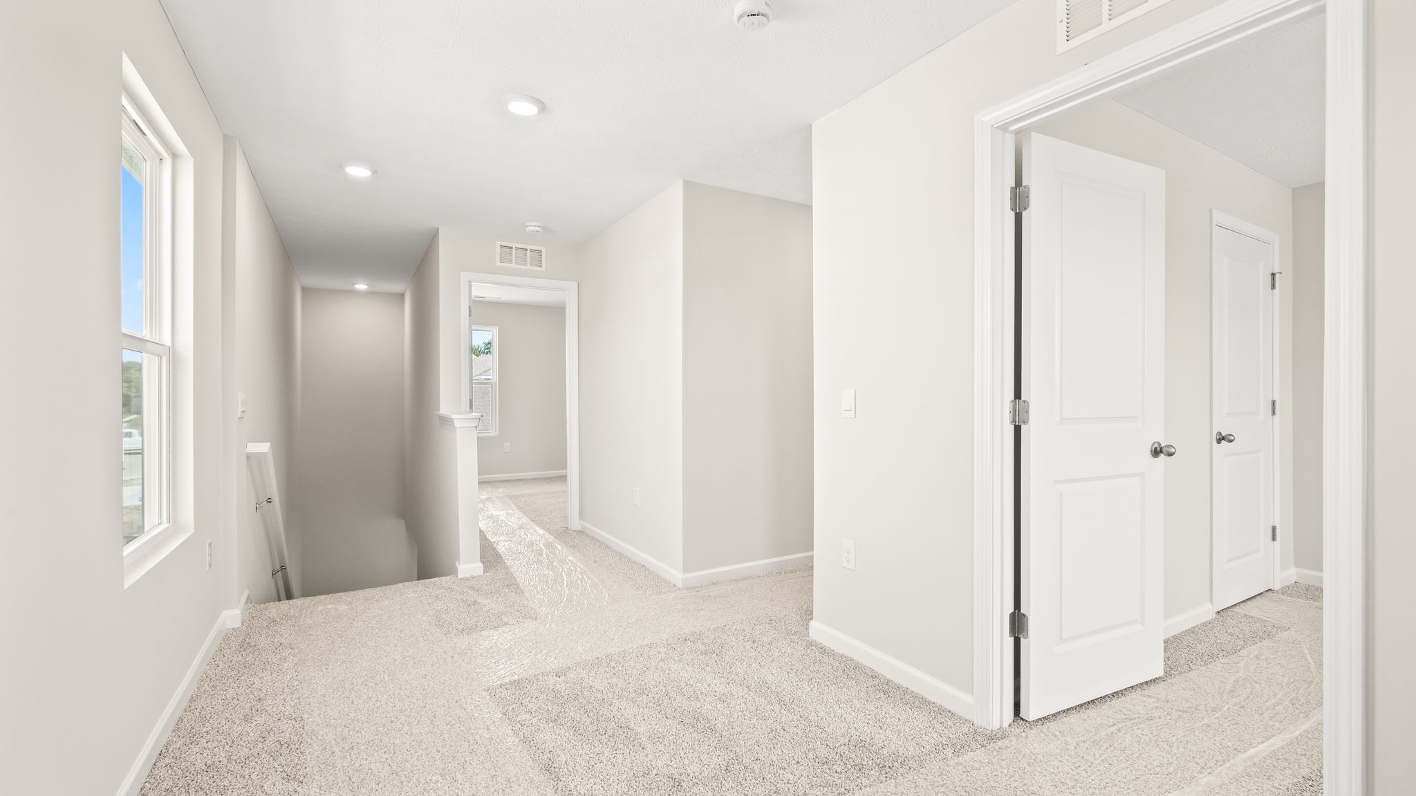 Upstairs landing with view of stairs downward
