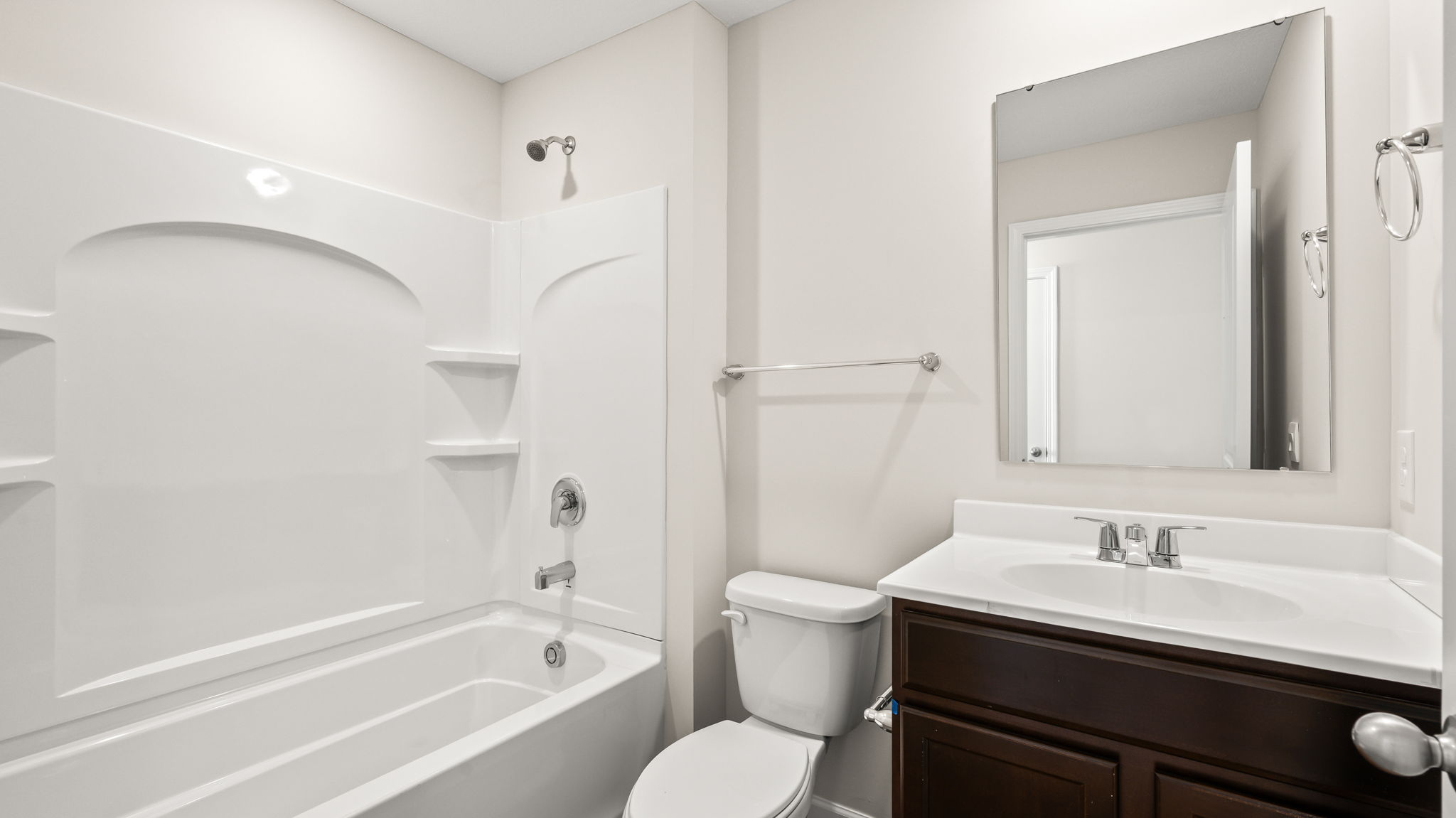 Bathroom with tub, toilet, and sink