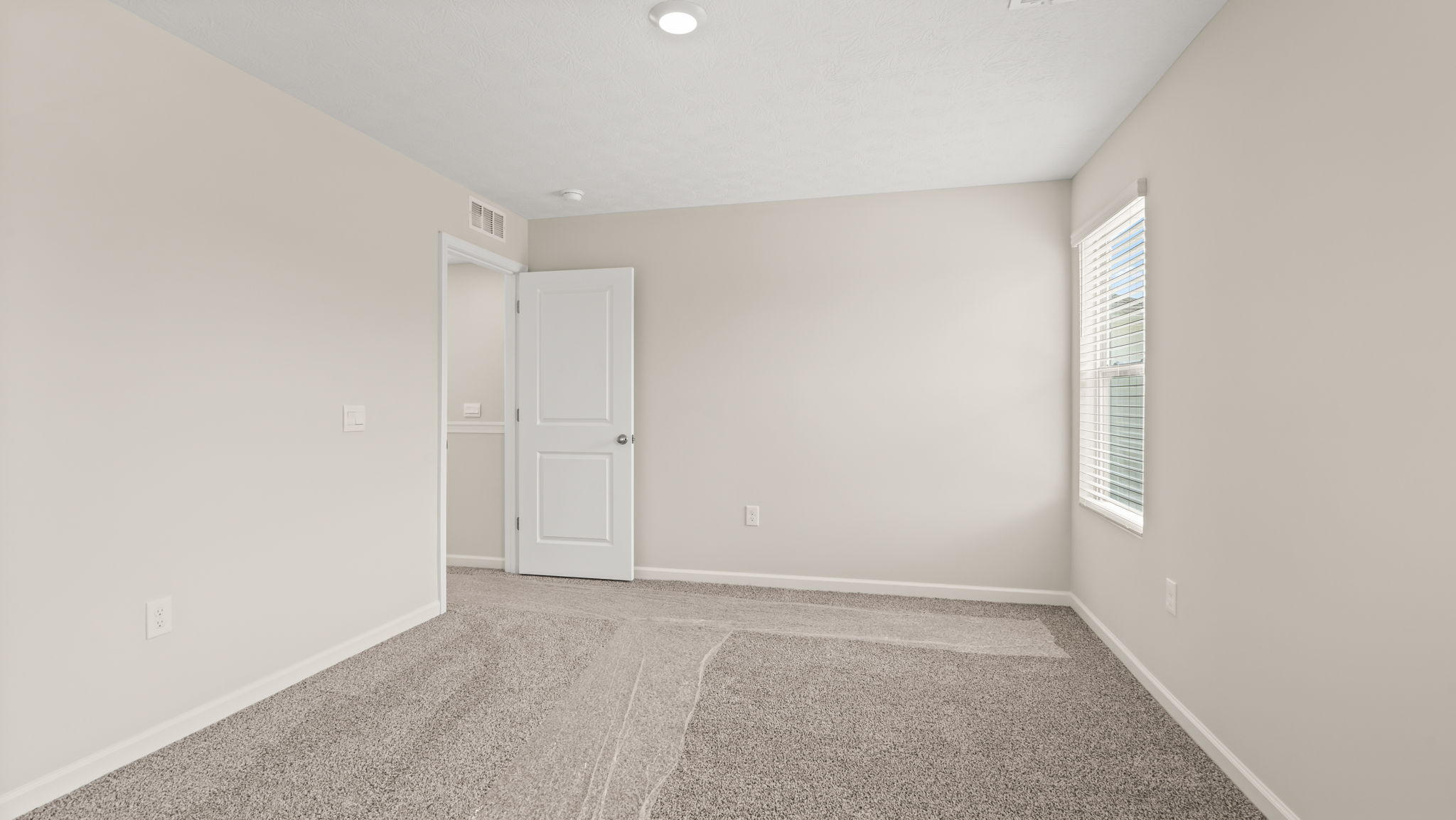 Primary bedroom with window