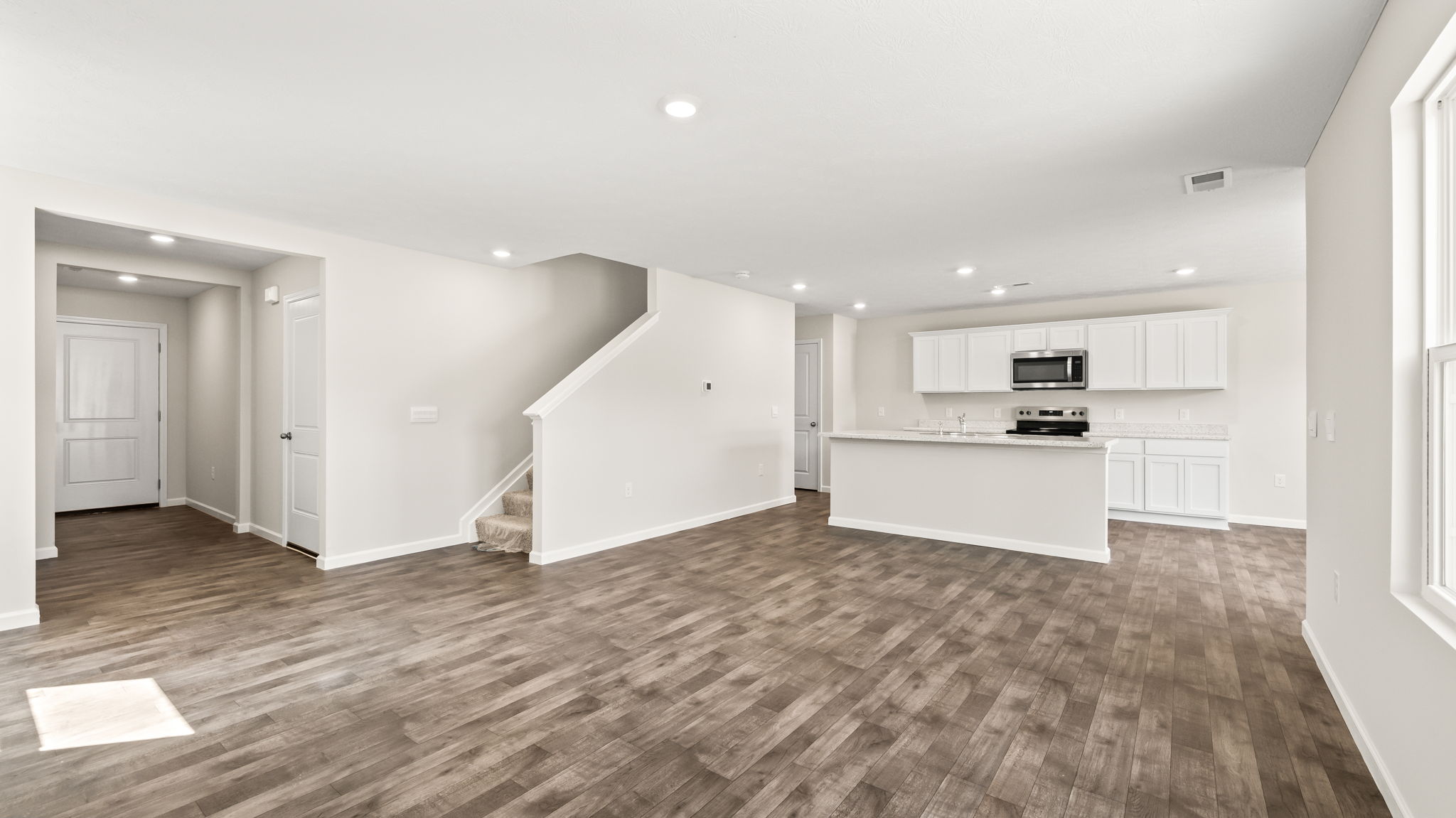 Great room with stairs to