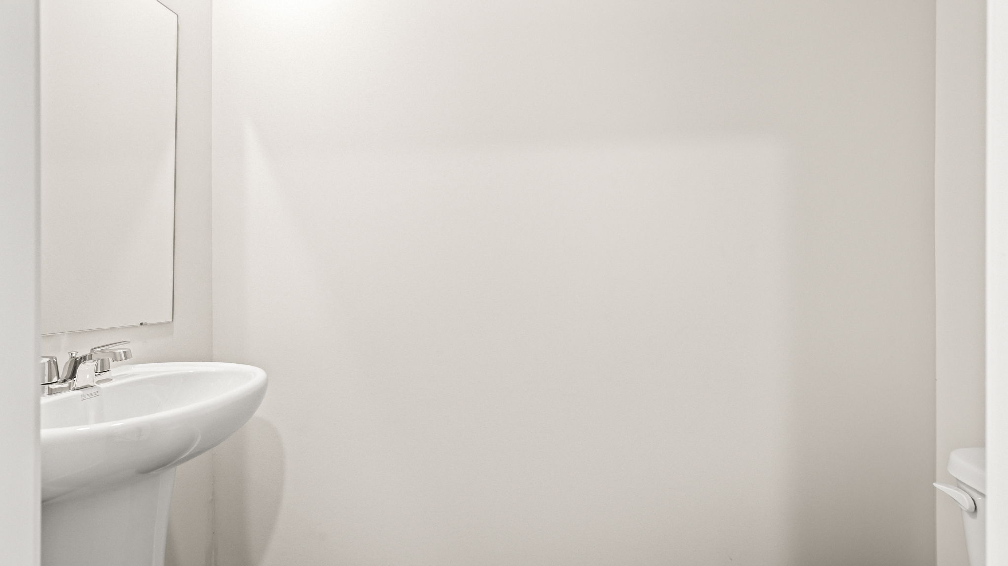 Powder room with sink and mirror