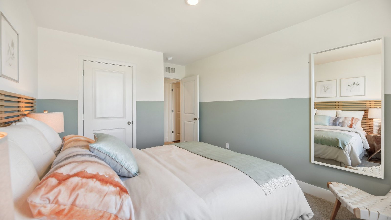 Bedroom with beautiful décor and view to the hallway.