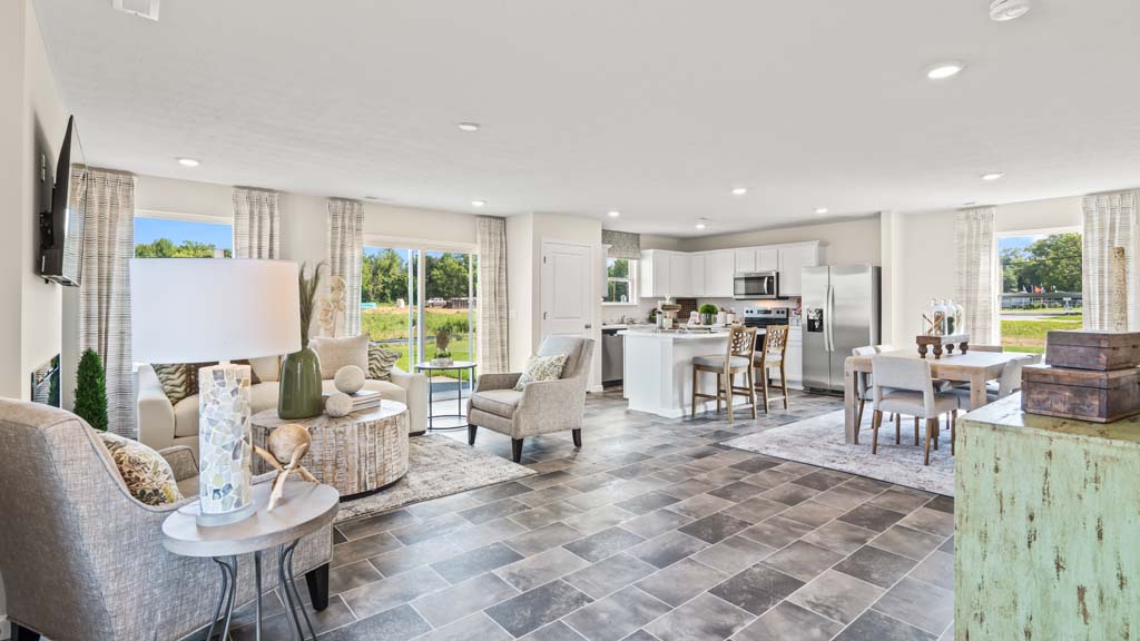 full view of great room with dining, living, and kitchen spaces with lots of natural light.