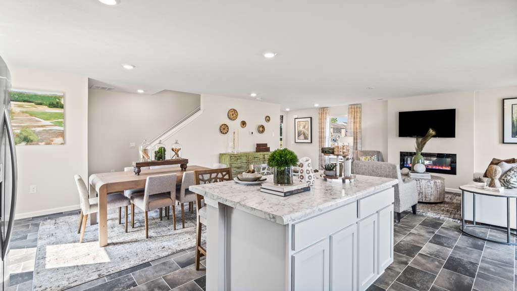 full view of great room with dining, living, and kitchen spaces with lots of natural light.